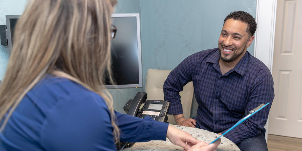 dentist talking to patient